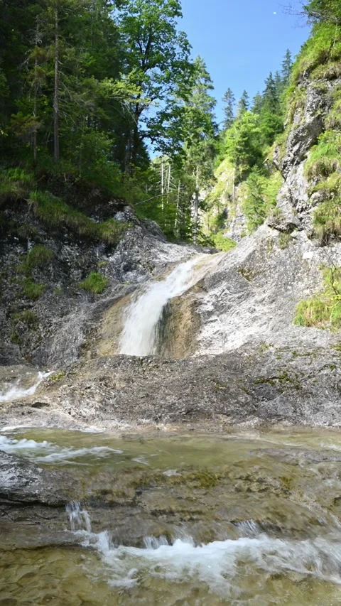 Vertical shot of a beautiful view on the main fountain at Staffelgraben mountain Stock-Footage 260909370