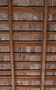 Vertical shot from below an antique ceiling with wooden suspenders Stock Photos