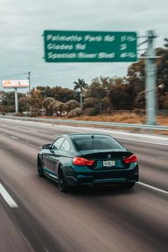 Vertical shot of BMW M4 during Supercar Saturdays Florida Stock Illustration