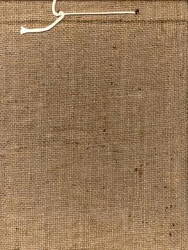 Vertical shot of a brown straw texture with a white thread Stock Photos