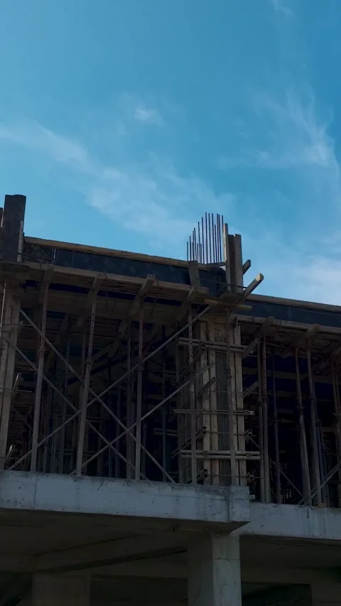Vertical shot of building under construction with concrete columns and masonry 库存影片 341895421