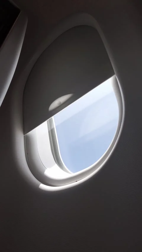 Vertical shot of a cabin window and the beautiful blue sky. Stock Footage 335737435