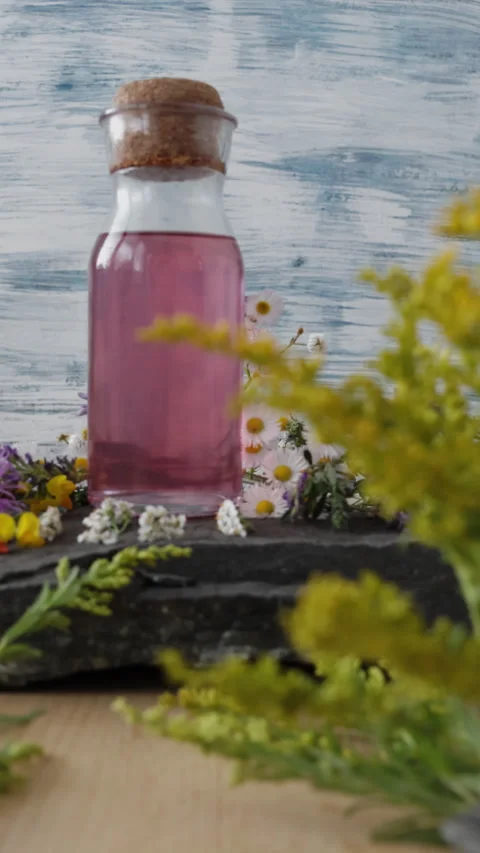 Vertical shot of camera moving forward through blurred meadow flowers to re.. 스톡 동영상 344322471