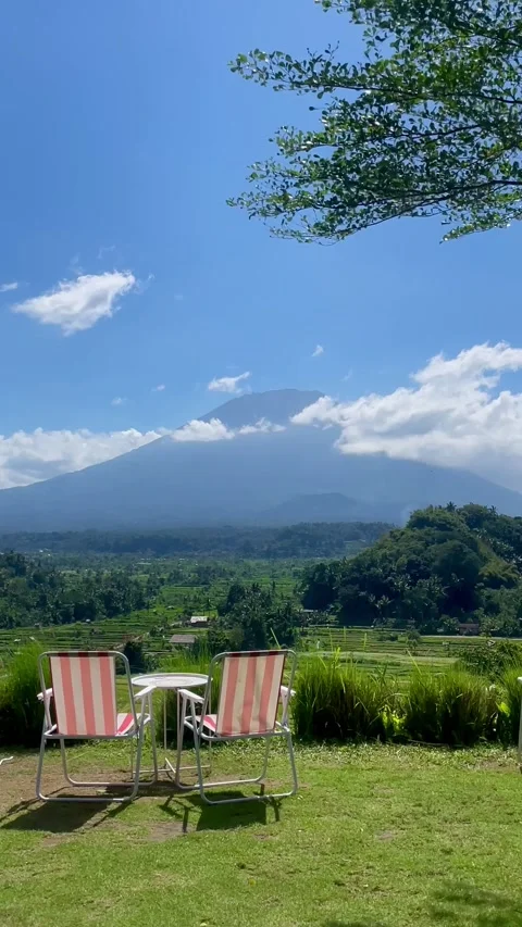Vertical Shot of Camping Chairs Facing Mount Agung View 動画素材 341552076