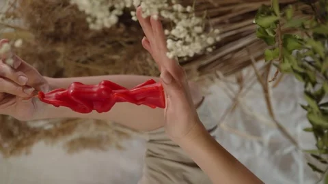 Vertical shot of a candle in a woman's hands Stock Footage 246415122