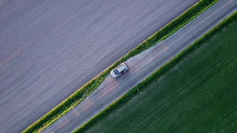 Vertical shot of a car in the field Stock Footage 276530079