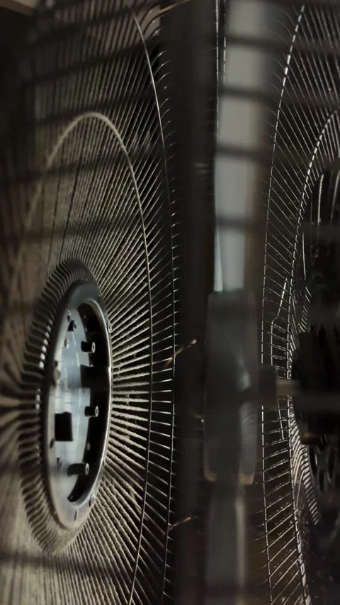 Vertical Shot. Close up abstract of rotating electric fan grill and blade m.. Video stock 344248573