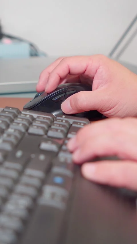 Vertical Shot Close Up Person Hands Typing and Scrolling Computer Mouse Stock Footage 341919781