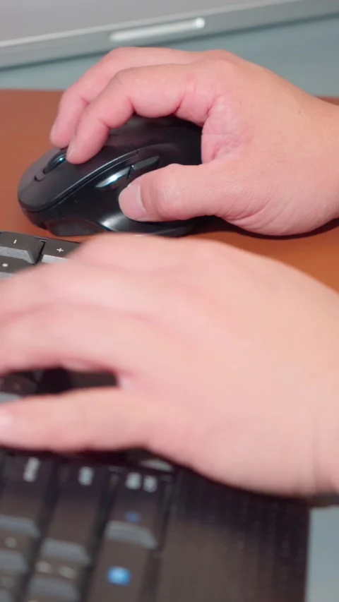Vertical Shot Close Up Person Hands Typing and Scrolling Computer Mouse Stock Footage 341919929
