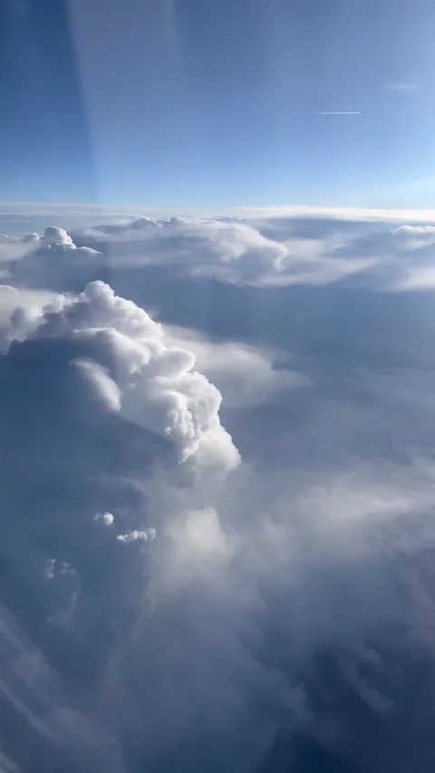 Vertical shot of clouds from plane window over motor with clear weather Stock Footage 277289383