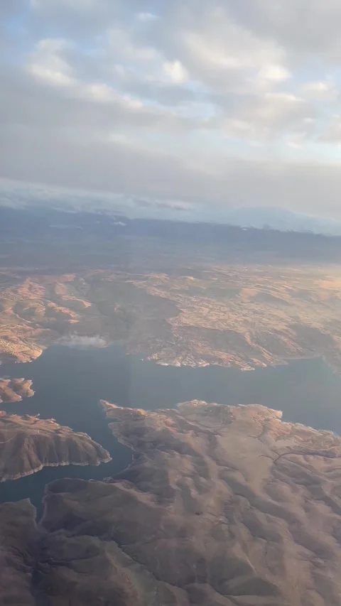 Vertical shot of clouds from plane window over motor with clear weather Stock Footage 277289420