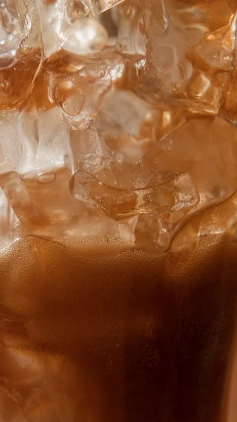 Vertical Shot Cola Glass with Ice Cubes Stock Footage 335859718