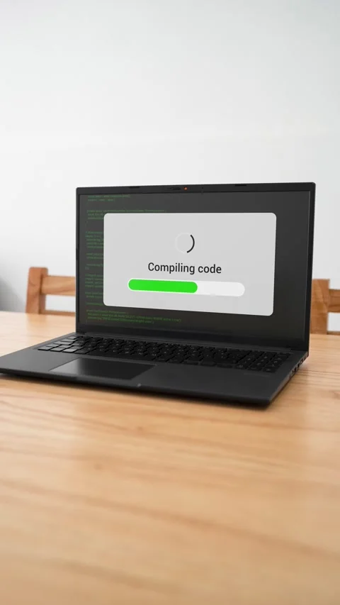 Vertical shot of a computer compiling new software code. Stock Footage 310334446