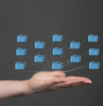 A vertical shot of computer file folders connected to the main cloud over a h Stock Photos