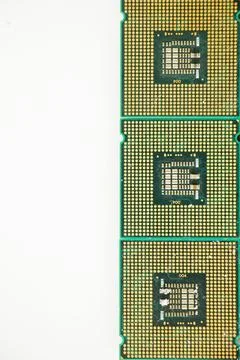 Vertical shot of computer microprocessors isolated on a white background Stock Photos