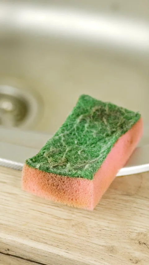 Vertical shot of a dirty sponge on the sink in the kitchen at home, household Stock Footage 300594246