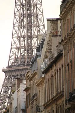 Vertical shot of the Eiffel tower part and buildings facades in Paris, France Stock Photos
