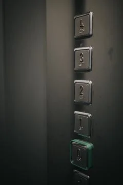 Vertical shot of an elevator buttons with numbers from 0 to 4 스톡 사진