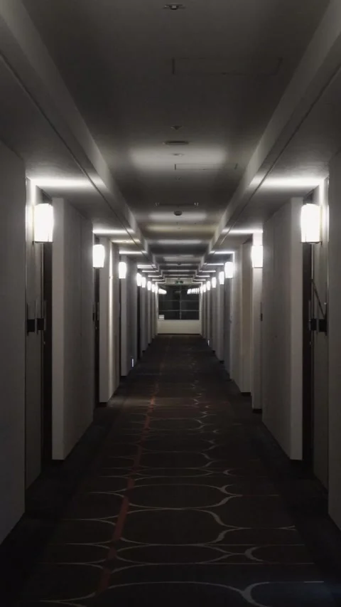 Vertical shot of an empty hallway of hotel rooms. Stock Footage 335736248