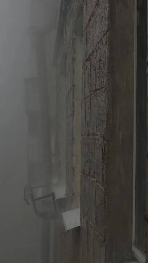 Vertical shot of facade of house during hailstorm with an audio. Stock Footage 253878448