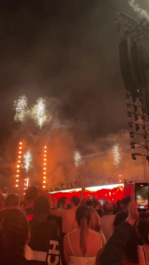 Vertical shot of fireworks and pyrotechnics erupting over the stage as the Stock Footage 346892921