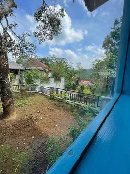 Vertical shot of garden plot with rural houses Stock-Fotos