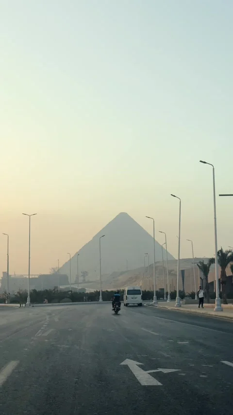 Vertical Shot of Giza Pyramids Rising above Cairo Urban Skyline Seen from City Stock Footage 341837910