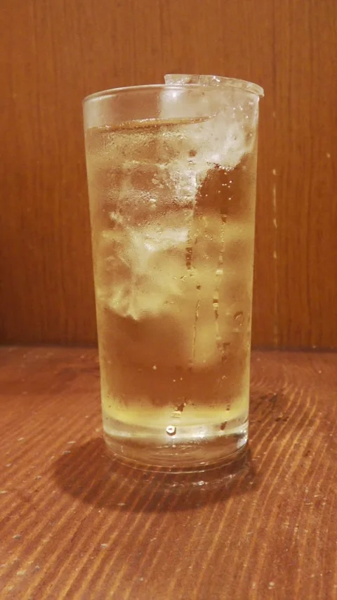 Vertical shot: A glass of ginger ale with ice. Stock Footage 317120447