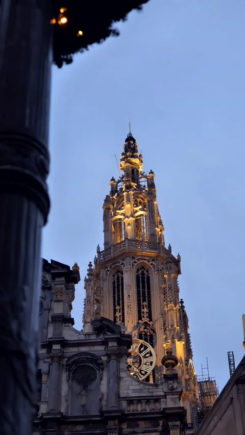 Vertical shot of gothic cathedral with light on in evening Видео 222068749