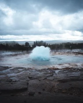 Vertical shot of the Great Geysir exploding in Iceland Stock Photos