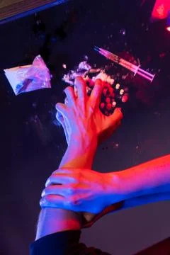 Vertical shot hand grabbed the evil clumsy hand of a young girl reaching for Stock Photos