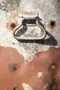 Vertical shot of a handle on rusty background Photos