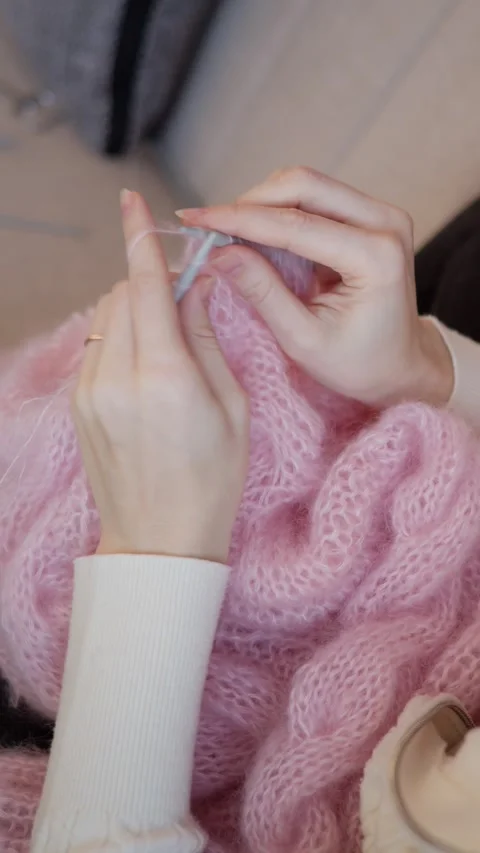 Vertical Shot of Hands Knitting Pink Wool Fabric Stock Footage 331161633