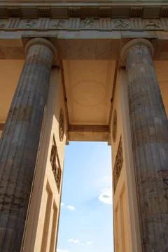 Vertical shot of high stone pillars or columns of an ancient construction Stock Photos