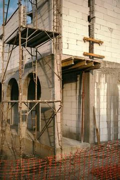 Vertical shot of a house under construction, showing brickwork walls, reinf.. Stock Photos
