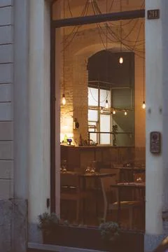 Vertical shot of the inside of a restaurant with string lights Stock Photos