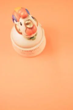 Vertical shot of a kitchen timer on an orange background Stock Photos