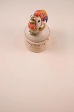 Vertical shot of a kitchen timer on a white background Stock Photos