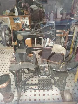 Vertical shot of a knitting machine on a background of a workshop, visible Fotos de archivo