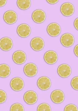 A vertical shot of lemon slices seamless pattern with shadows on a light pink Stock Photos