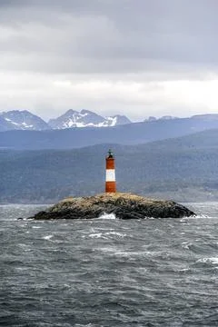Vertical shot of Les Eclaireurs lighthouse on a rocky island in the Beagle .. Stock Photos