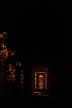 Vertical shot of the light shining through a middle eastern model window in the Stock Photos