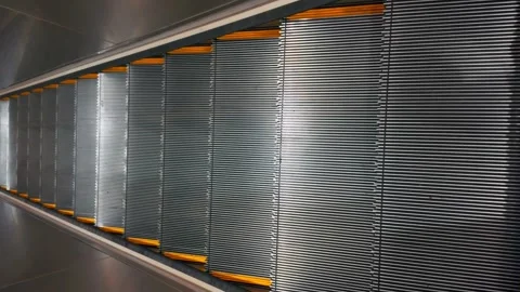 A vertical shot, looking down and going down on a well lit and shiny Video stock 273430821