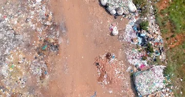 Vertical shot looking down on piles of rubbish in rural trash dump 4K Stock Footage 85643782