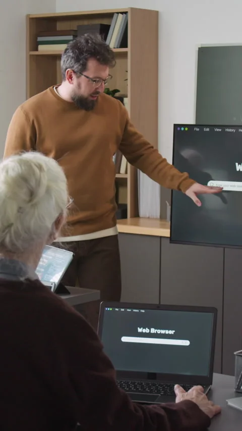 Vertical Shot of Man Teaching Internet Basics in Computer Class Stock Footage 333712455
