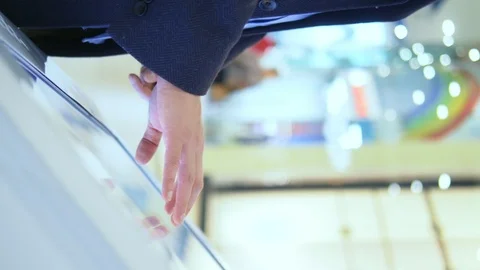Vertical shot. man uses touch screen at the information Desk in the supermarket Stock-Footage 125774404