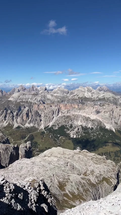 Vertical Shot of Massive Dolomite Rock Faces from the Summit of Pisciadu, Italy Stock Footage 330961089
