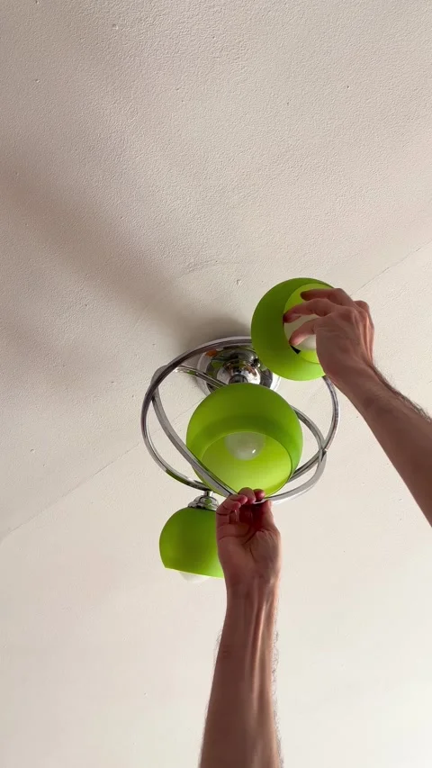 Vertical Shot. Mobile tutorial for replacing ceiling light bulb for rental .. Stock Footage 338190018
