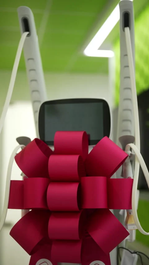 Vertical shot of modern mesotherapy tool with festive bow celebrating Stock Footage 310620148
