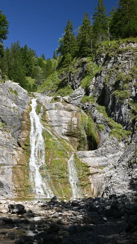 Vertical shot of a mossy waterfall in late summer, Glasbach Wasserfall Stock-Footage 260891909
